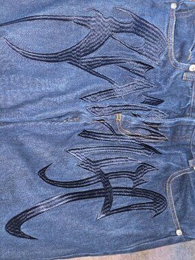 Revenge embroidered jeans